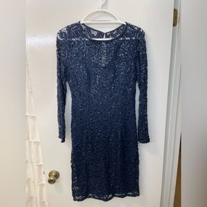 Marina size 10, navy lace and sequin overlay dress with long sleeves.